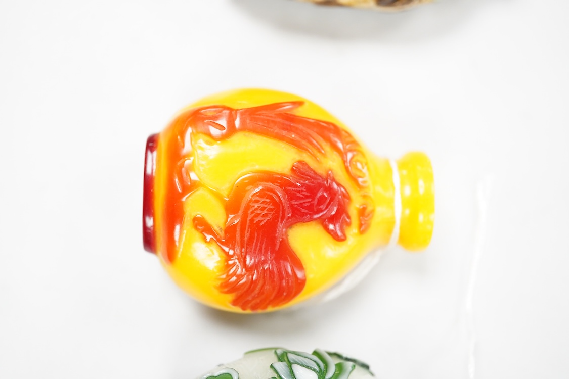 Three Chinese glass snuff bottles and a porcelain snuff bottle(4), tallest 8cm high